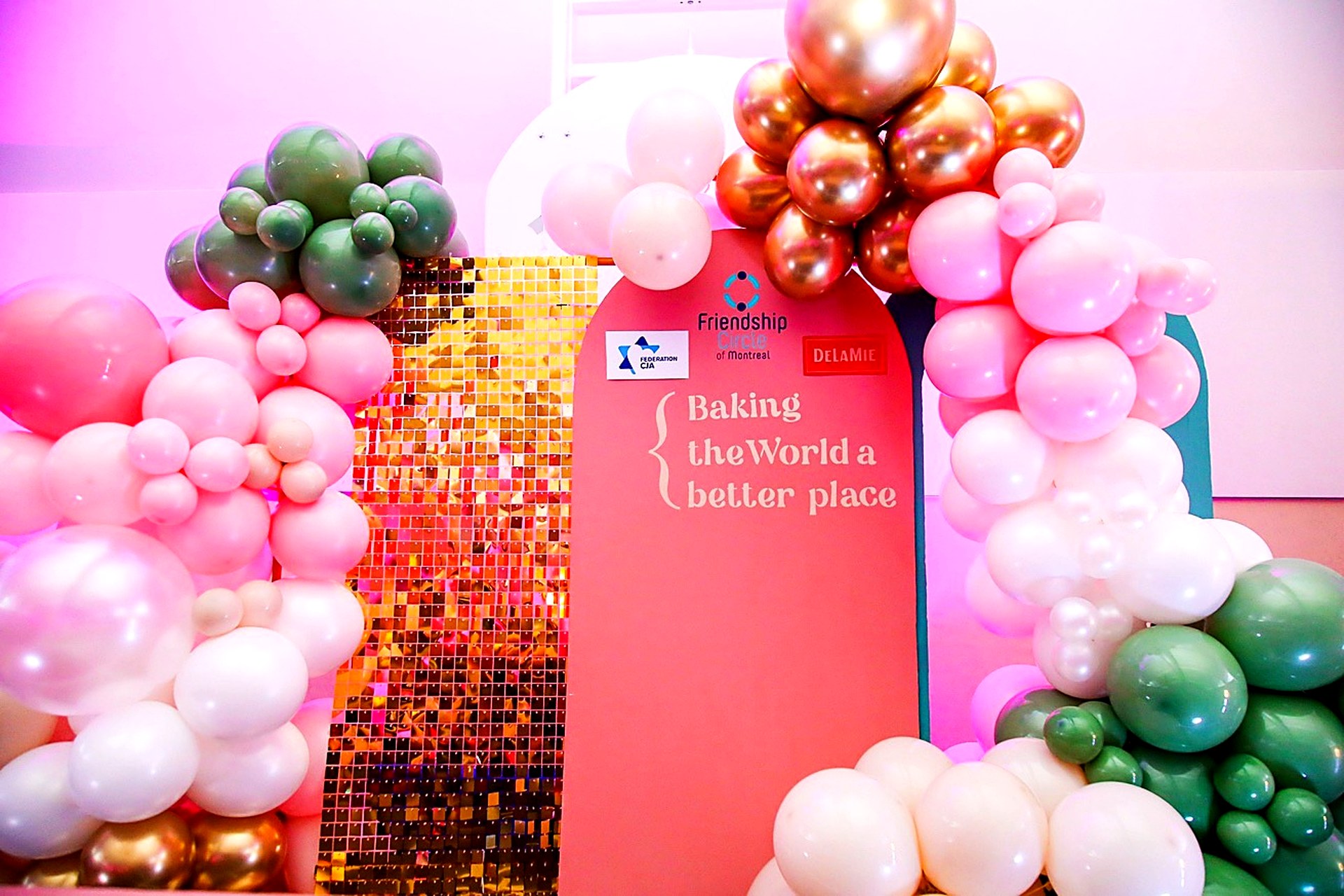 Balloon garland and shimmer wall backdrop at a corporate event in Montreal